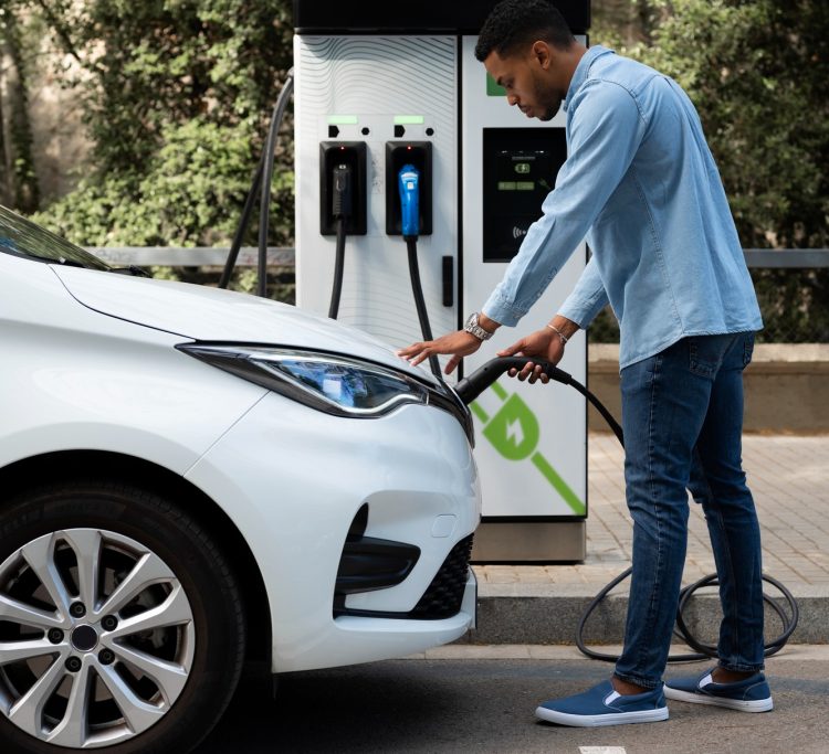 full-shot-man-charging-electric-car (1)