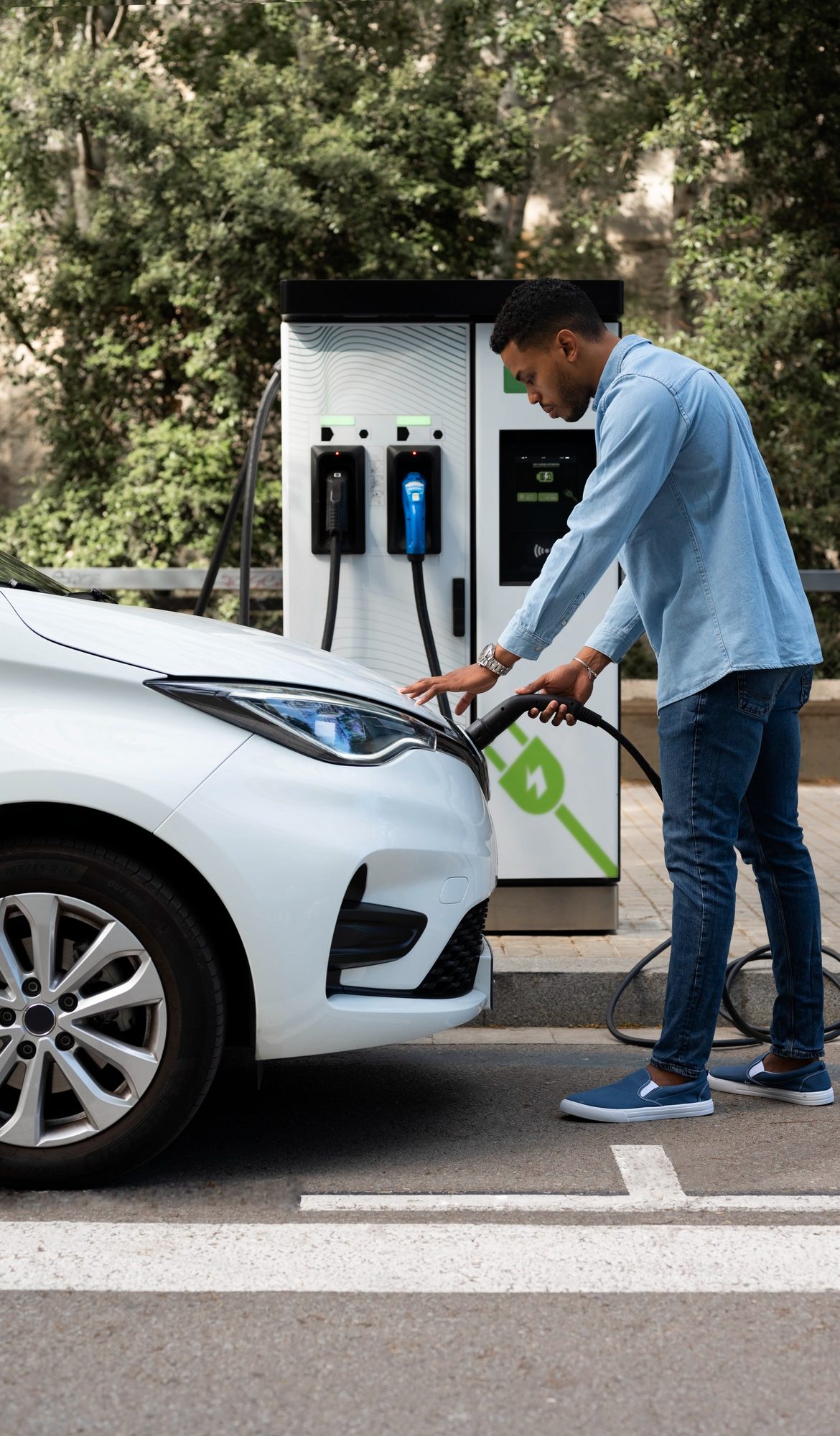 full-shot-man-charging-electric-car (1)
